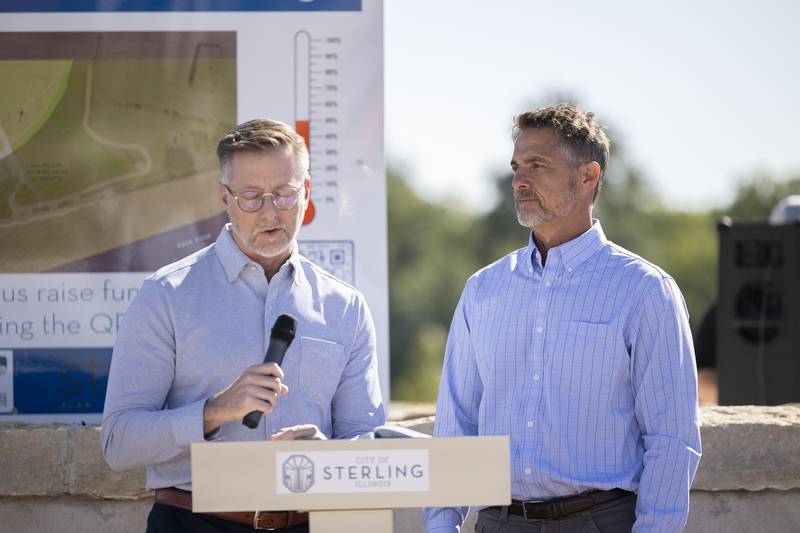 Riverfront commissioners Mark Geil (left) and Terry McGuire speak about the riverfront project Tuesday, October. 1, 2024, during the ground breaking.