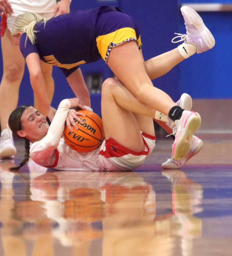 Huntley’s Aubrina Adamik, bottom, battles Hononegah’s Carly Koch for the ball in girls basketball at Dundee-Crown High School in Carpentersville on Tuesday, November 25, 2025.