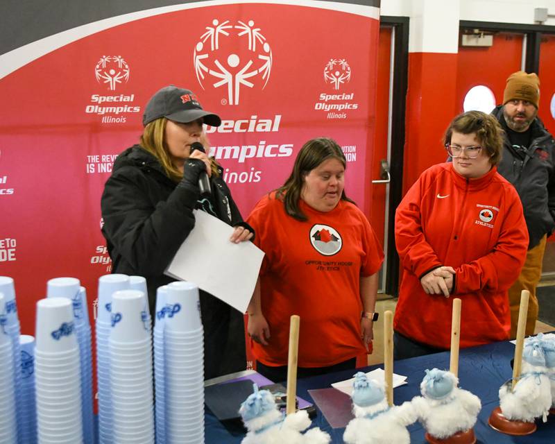 Katie Risley, Director of Development, along with Shelby Edwards and Lisa Steinbis welcome everyone to the Polar Plunge and to hand out awards to participants before taking the plunge on Saturday Feb. 21, 2026, held at Huskie Stadium in DeKalb.