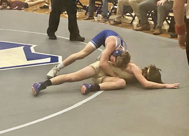 Princeton's Augustus Swanson tries to keep Morris' Owen Sater on the mat durng Tuesday night's match at Prouty Gym.