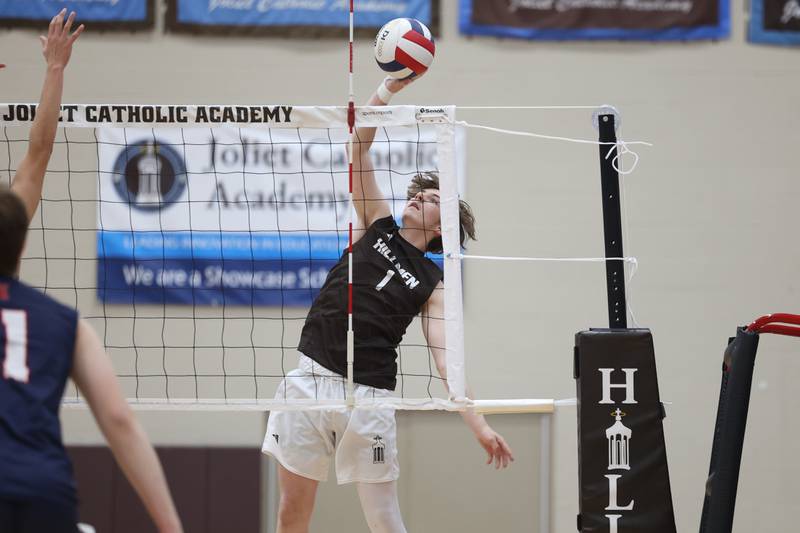 Joliet Catholic’s Jacob Medders hits a shot against St. Viator on Wednesday, April 24, 2024 in Joliet.