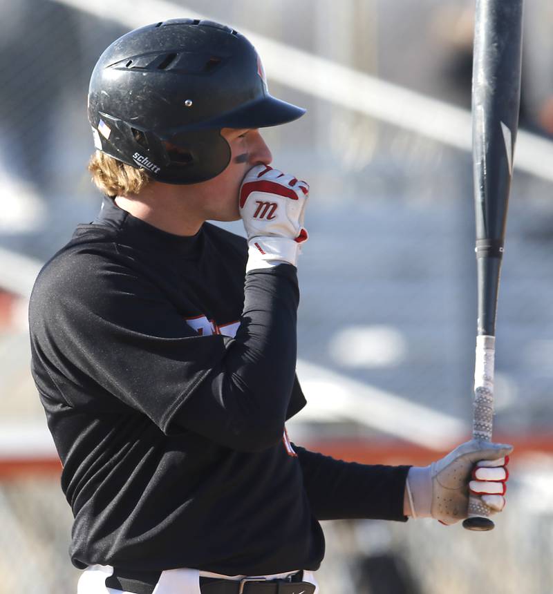 Crystal Lake Central's Mason Lechowicz warms his hand as he bats during a nonconference baseball game against Boylan Wednesday, March 29, 2023, at Crystal Lake Central High School.