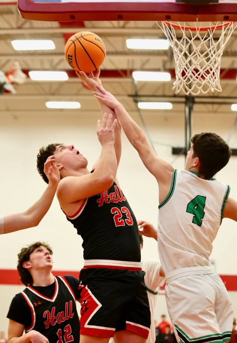 Hall's Aiden Redcliff gets a helping hand from Eureka's Cohen Alstat Tuesday night at Hall High School.