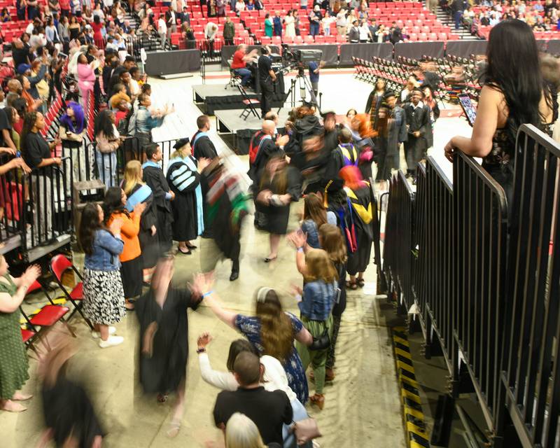DeKalb High School seniors exit the graduation ceremony during the recessional portion of the event on Saturday May 23, 2026, held at the Convocation Center in DeKalb.