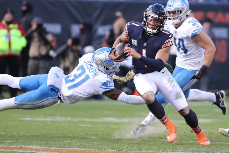 Chicago Bears quarterback Justin Fields gets past Detroit Lions safety Kerby Joseph on his way to a long touchdown run in the fourth quarter of their game Sunday, Nov. 13, 2022, at Soldier Field in Chicago.