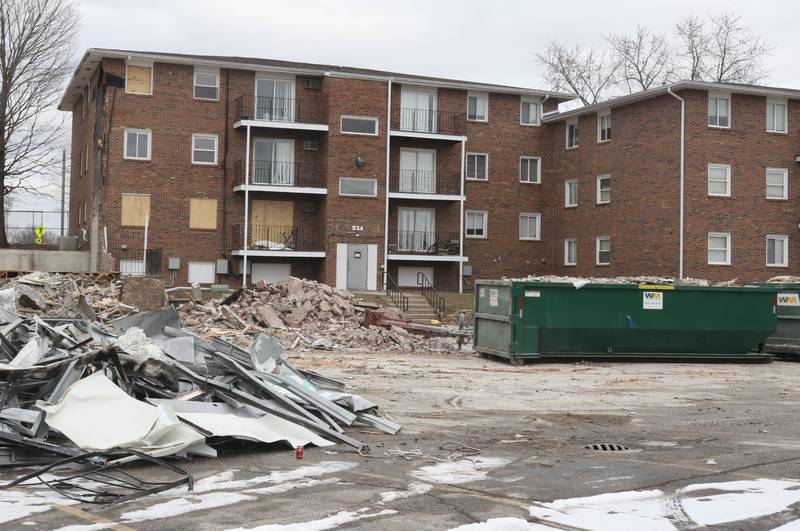 Only a portion of the apartments at 1024 W. Hillcrest Drive in DeKalb remain after some of the building was demolished earlier in the day. The structure was ravaged by fire on Dec. 22, 2024, and condemned.
