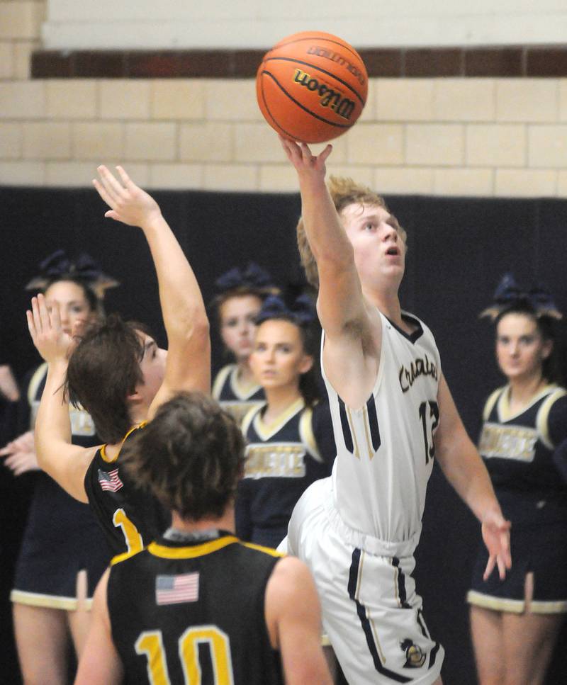 Marquette's Griffin Walker shoots against Putnam County at Bader Gymnasium on Friday, Feb. 3, 2023.