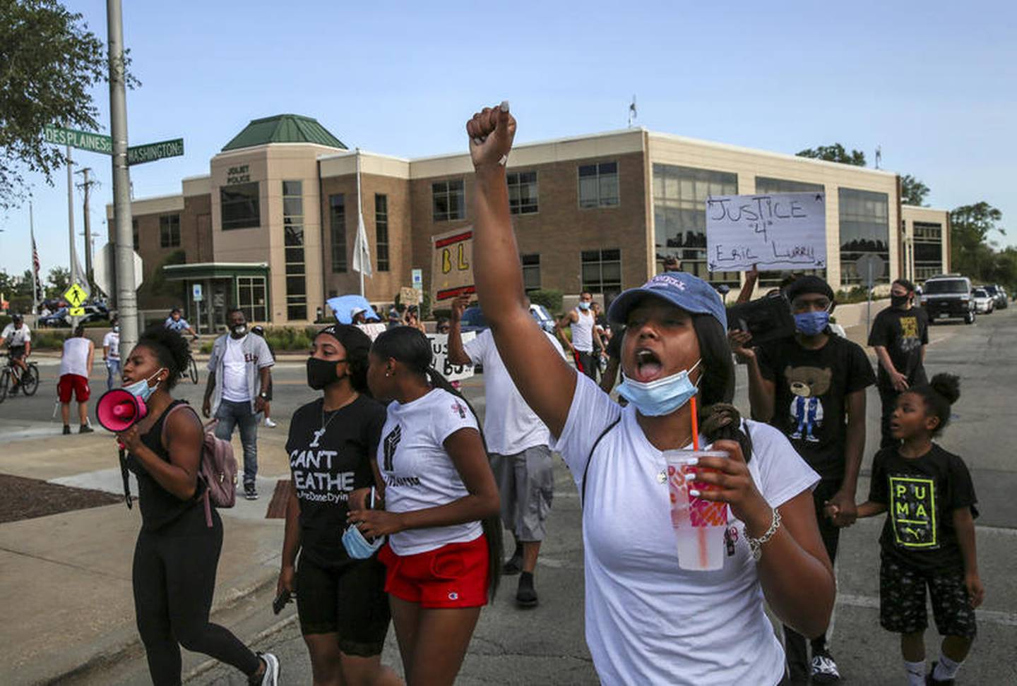 Demonstrators can be seen protesting outside Joliet City Hall, the Will County Courthouse and the Joliet Police Department on Saturday, Aug. 22, 2020, in response to the January 28 overdose death of Eric Lurry who died in police custody.