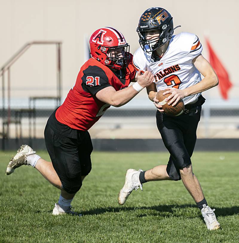 Amboy’s Quinn Leffelman sacks FCW quarterback Seth Jones for a safety Saturday, Nov. 4, 2023, in an eight-man semifinal playoff game in Amboy.