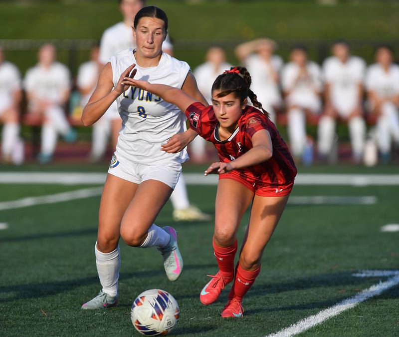 Hinsdale Central’s Emily DiTomasso (right) and Lyons Township’s Carolina Capizzi (8) got after the ball during a game on April 29, 2025 at Hinsdale Central High School in Hinsdale.