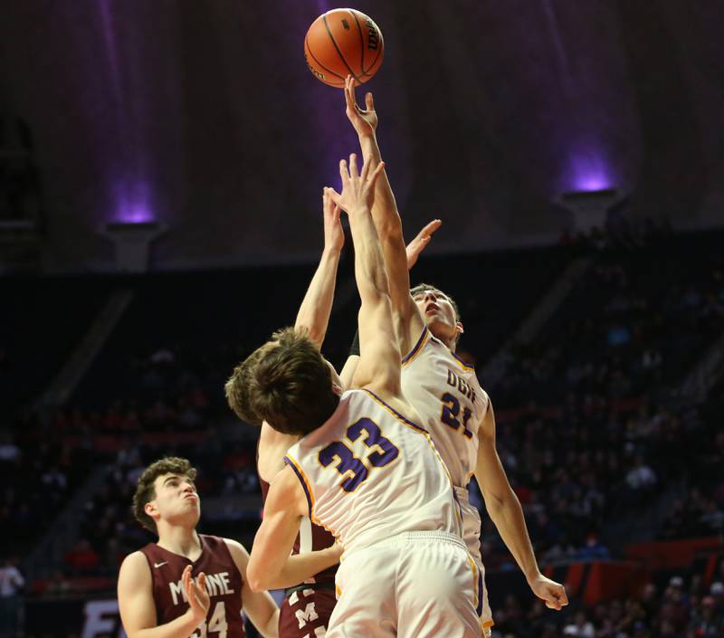 Downers Grove North's Jack Stanton misses a rebound with teammate Finn Kramper against Moline during the Class 4A state semifinal game on Friday, March 10, 2023 in Champaign.
