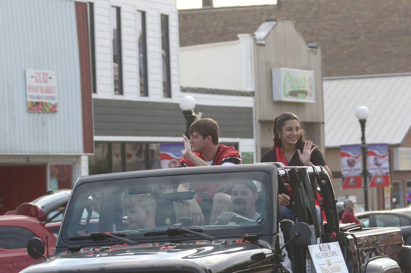 Hall homecoming king candidate Jacob Mongan and queen candidateNatalia Zamora ride during the Homecoming parade on Thursday, Sept. 18, 2025 downtown Spring Valley.