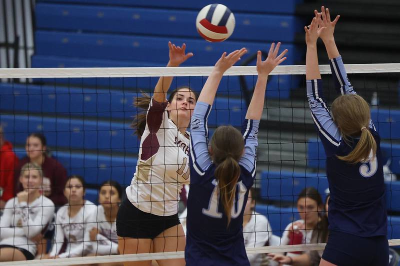 Morris’ Emma Leavitt hits a shot over the defense of Plainfield South on Monday, Sept. 25, 2023 in Plainfield.