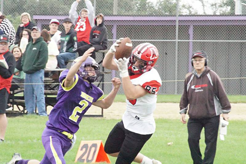 Amboy's Brennan Blaine hauls in a pass Saturday, Sept. 24, 2022 against Orangeville.