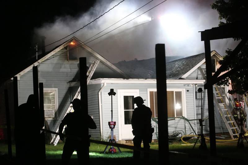 Flames emit from an upstairs window of a structure fire in the 100 block of West Cleveland Street on Thursday, May 15, 2025 in Spring Valley. The fire broke out shortly before 8:30p.m. Fire departments from La Salle Bureau and Putnam Counties responded to the scene. A mutual aid box alarm system (MABAS) call was issued prompting the response.