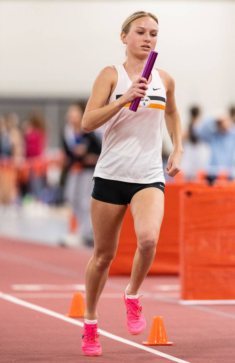 Wheaton Warrenville South’s Nicole Poglitsch participates in the 4x800 meter run during the Girls Track and Field DuKane Conference Meet at Batavia High School on Saturday, March 22, 2025.