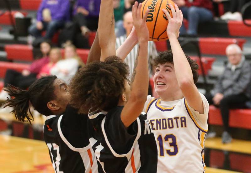 Mendota's Drew Becker shoots a jump shot over Kewanee's Brayden Conley during the 50th annual Colmone Classic on Thursday, Dec. 12, 2024 at Hall High School.