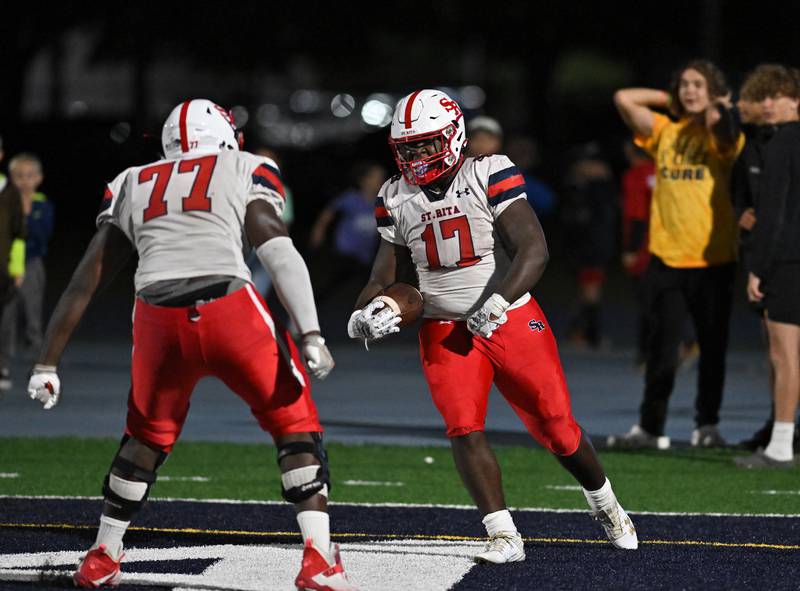 St. Rita's DJ Stewart II scores a touchdown late in the 4th quarter during a non-conference game against Joliet Catholic on Friday, Sep. 08, 2023, at Joliet. (Dean Reid for Shaw Local News Network)