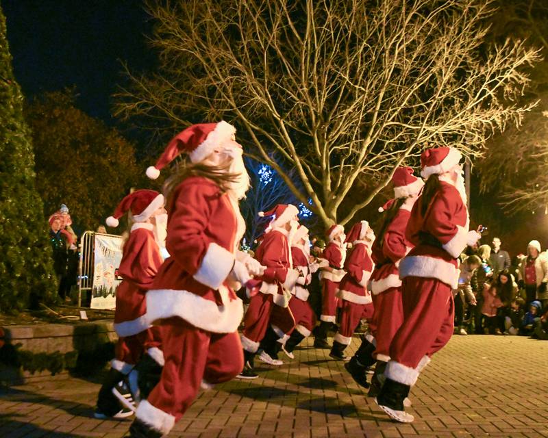 Dancing Santa’s preform before the tree lighting ceremony on Friday Nov. 21, 2025, held at Riverfront Park in Yorkville.
