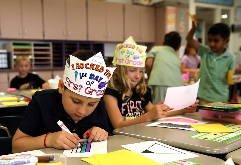 Theo Malai and Isabella Sosine color during the first day of school on Tuesday, Aug. 12, 2025, at District 300's Westfield Community School in Algonquin.