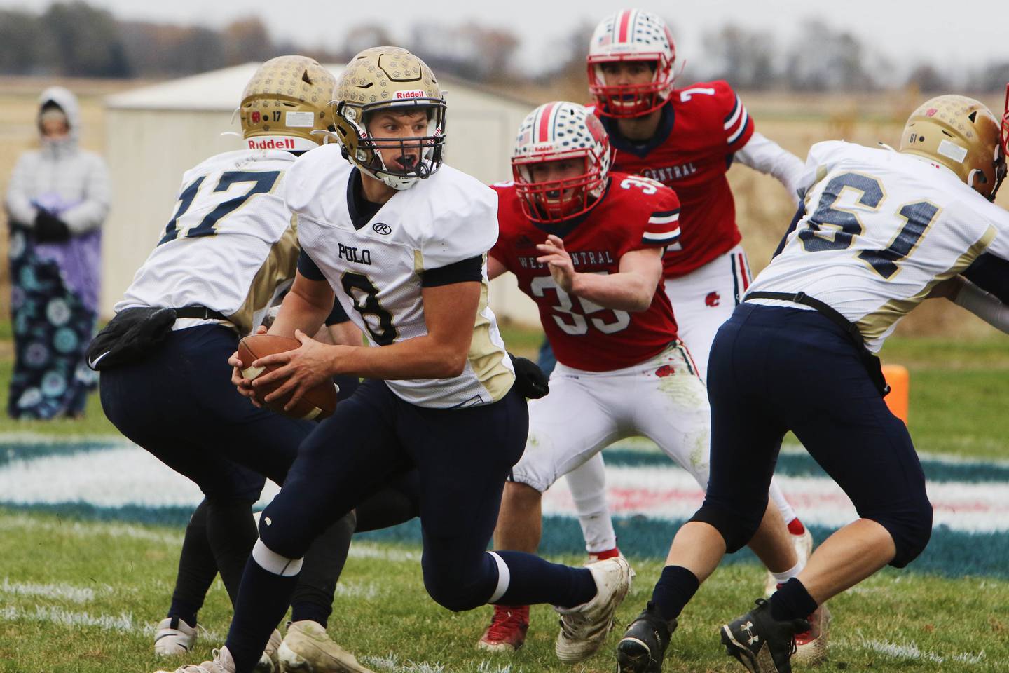 Polo quarterback Tyler Merdian (8) drops back to pass the ball during the first half of an Illinois 8-Man semifinal playoff game against West Central on Saturday, Nov. 13, 2021 in Biggsville.