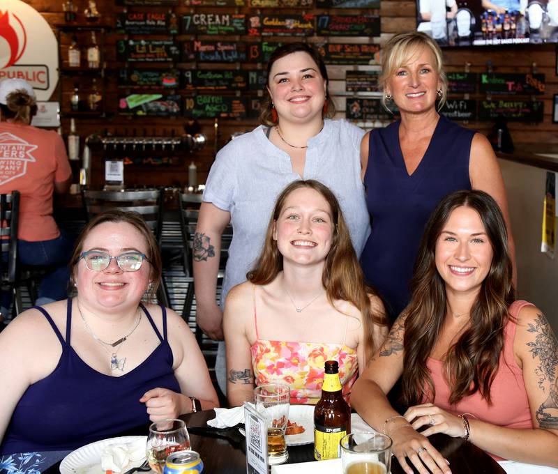 Top row: Ashley Anderson, Angie Davis, bottom row: Jordan Powell, Collette Wilmer, Meredith Hill (Angie’s Sugar Buzz Bakery) pose for a photo on Wednesday, June 25, 2025.