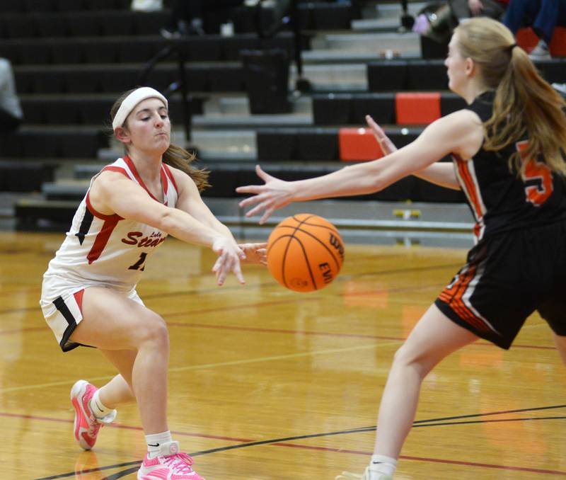 Fulton's Breleigh Hayton-Terrock (left) passes to a teammate during a Friday, Jan. 24, 2025 game at Fulton High School.