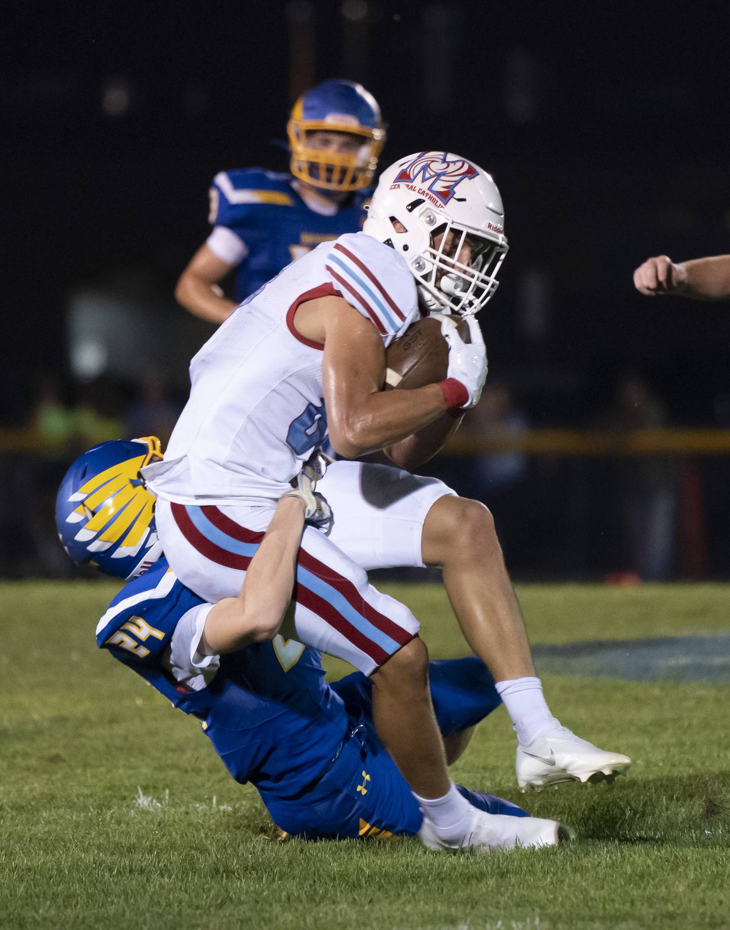 Marian Central's Christian Bentancur is taken down by Johnsburg's Tyler Pfefferkorn during the their game on Aug. 27, 2021 in Johnsburg.