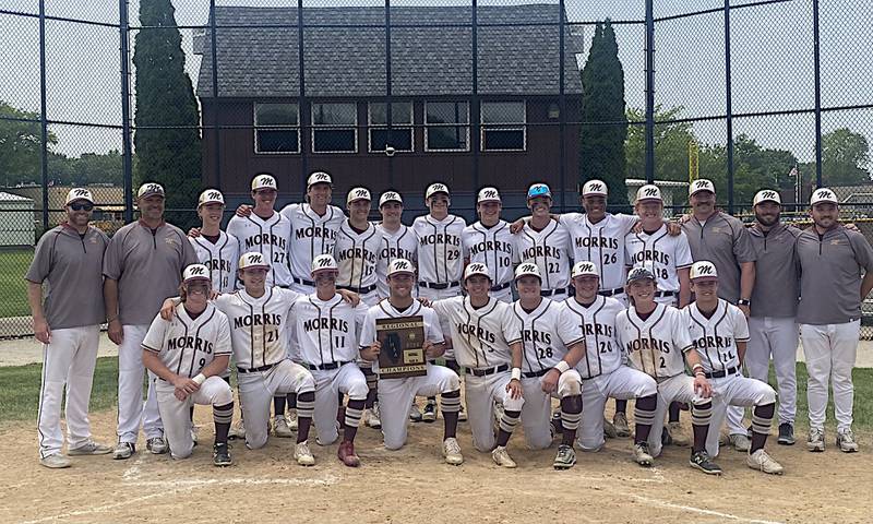The Morris baseball team poses with its Class 3A Morris Regional championship plaque after a 10-0 win over LaSalle-Peru on Saturday.