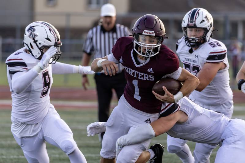 Lockport's Brendan Miller picks-up some yards during a varsity football home game against Plainfield North on Aug. 29, 2025.