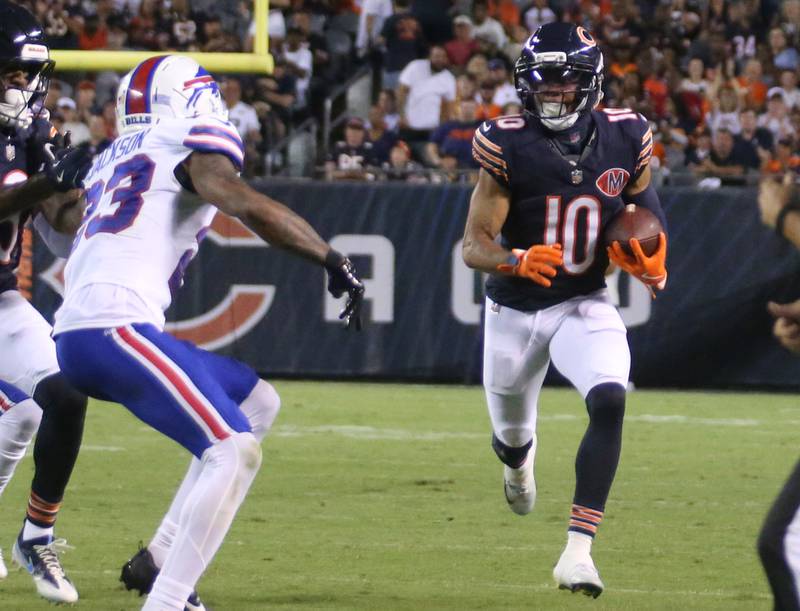 Chicago Bears wide receiver Tyler Scott sprints to the sideline as Buffalo Bills corner back Dane Jackson is shoved away from the play on Sunday, Aug. 17, 2025 at Soldier Field in Chicago.