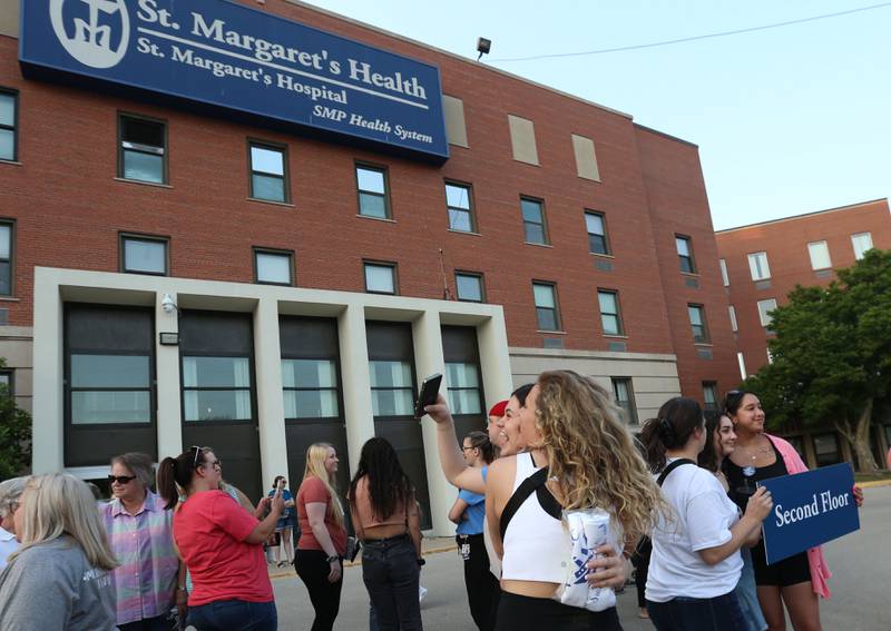 St. Margaret's employees take photos at St. Margaret's Hospital on Friday, June 16, 2023 in Spring Valley.