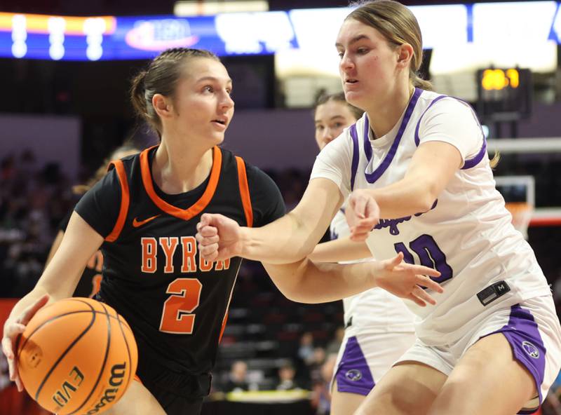 Byron's Larkin Knoll dribbles in the lane against Breese Central's Alyssa Moore during the Class 2A title game on Saturday, March 7, 2026 at CEFCU Arena in Normal.