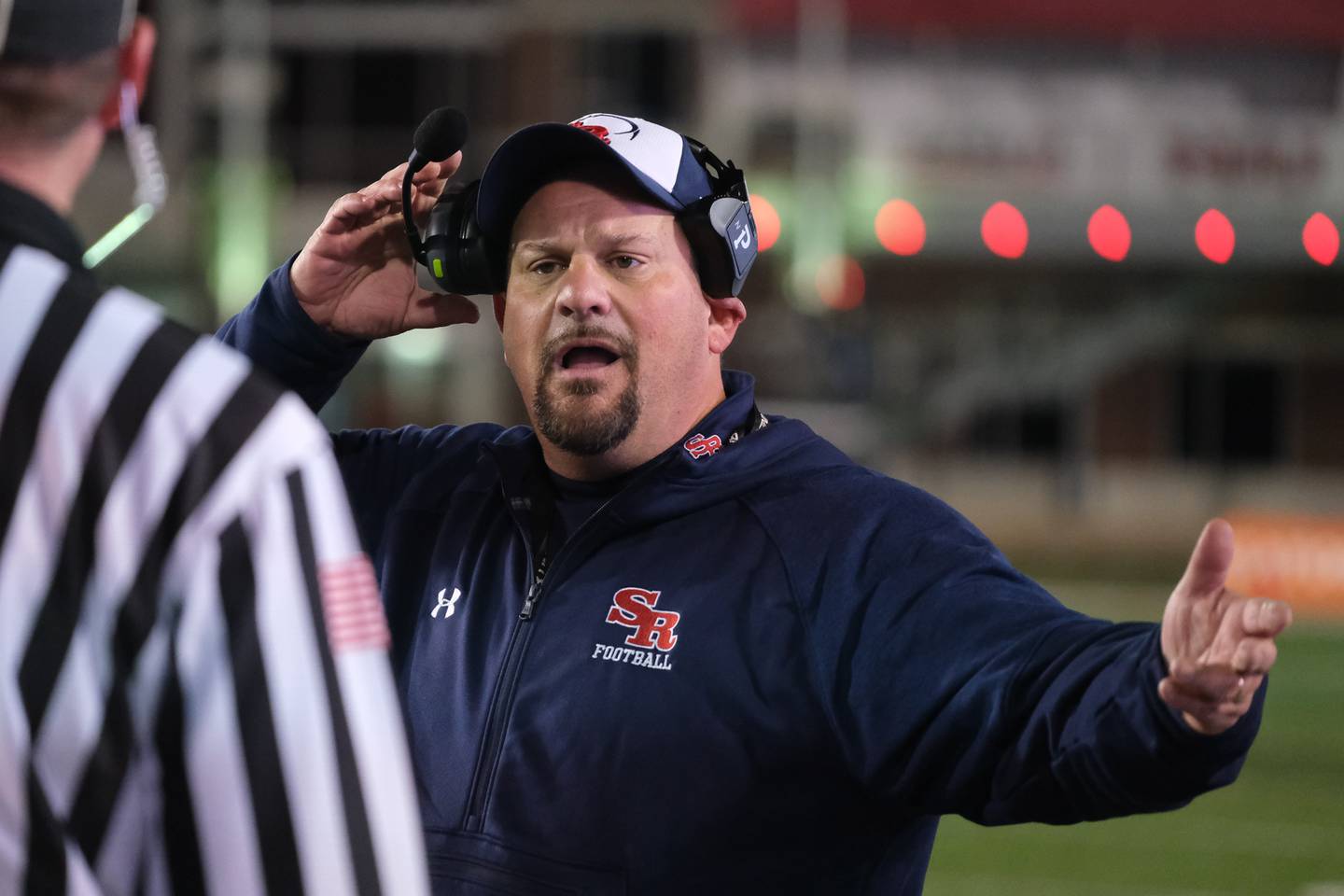 St. Rita head coach Todd Kuska questions a call during the game against Wheaton North in the Class 7A state championship at NIU Huskie Stadium. Saturday, Nov. 27, 2021 in Dekalb.
