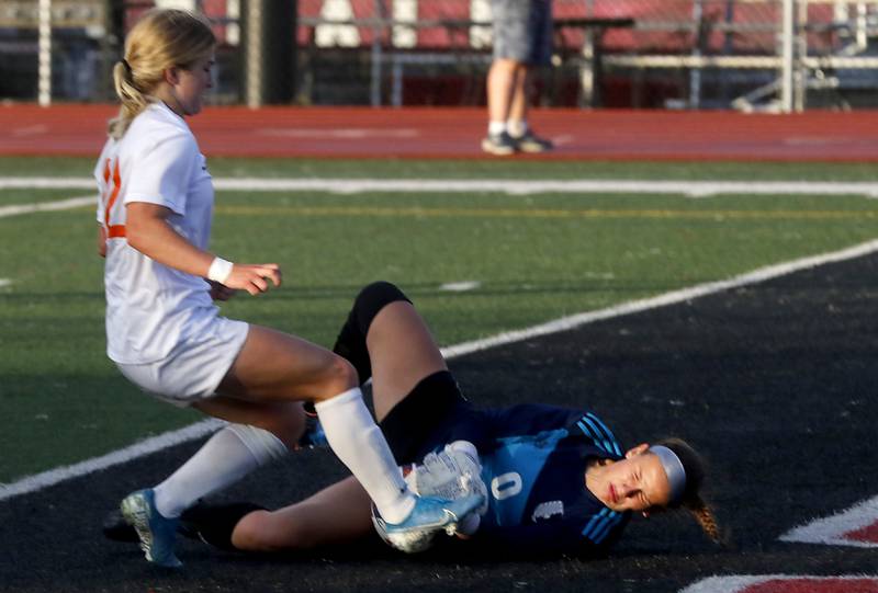 Crystal Lake Central's Olivia Anderson tries to kick the ball into the goal as St. Ignatius College Prep's MC Galante tries to block the shot during the Class 2A Deerfield Supersectional girls soccer match on Tuesday, May 28, 2024, at Deerfield High School.
