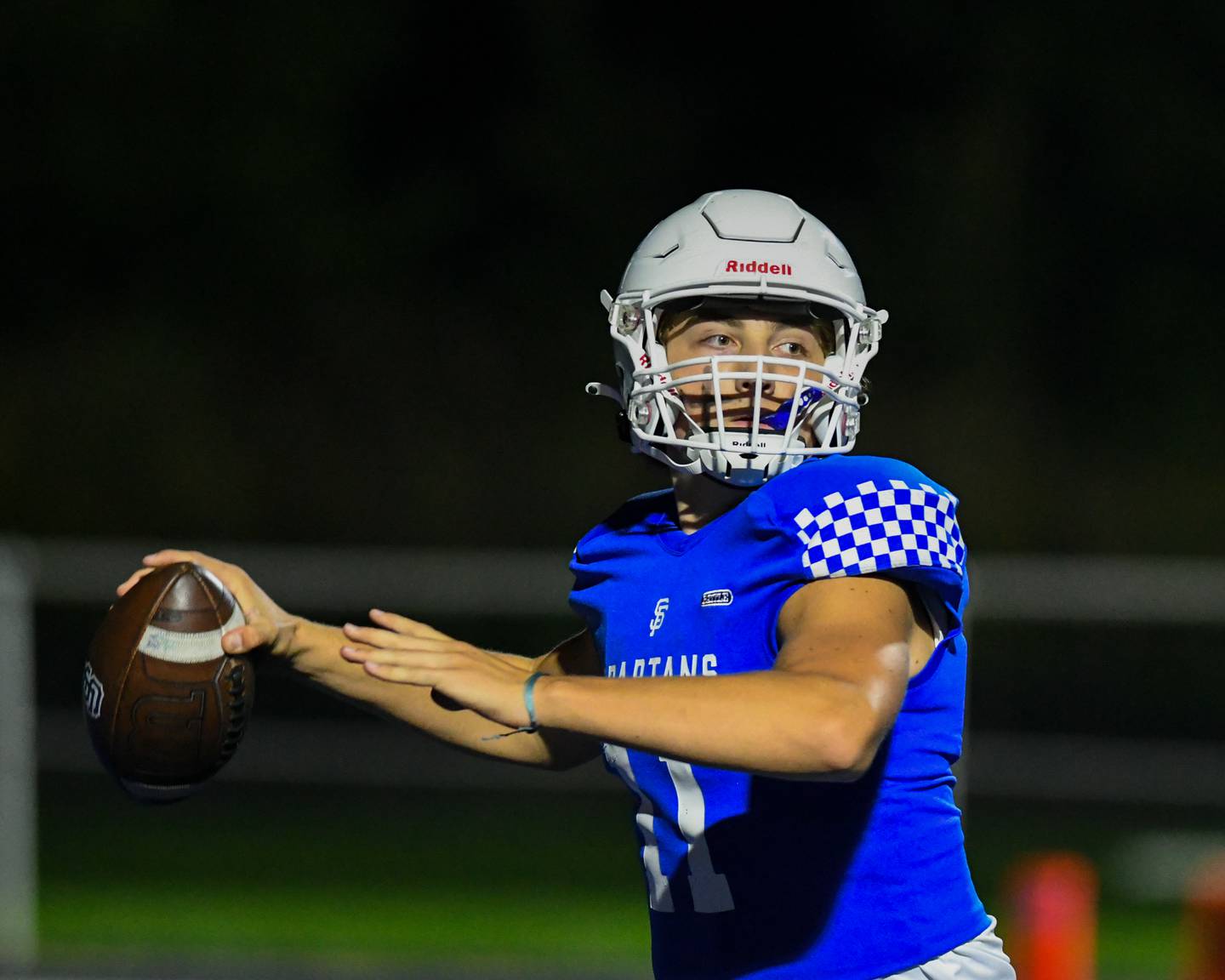 St. Francis Alessio Milivojevic completes a 45 yard pass to teammate Tanner Glock in the first quarter on Friday Sep. 29, 2023, while taking on IC Prep at St. Francis in Wheaton.