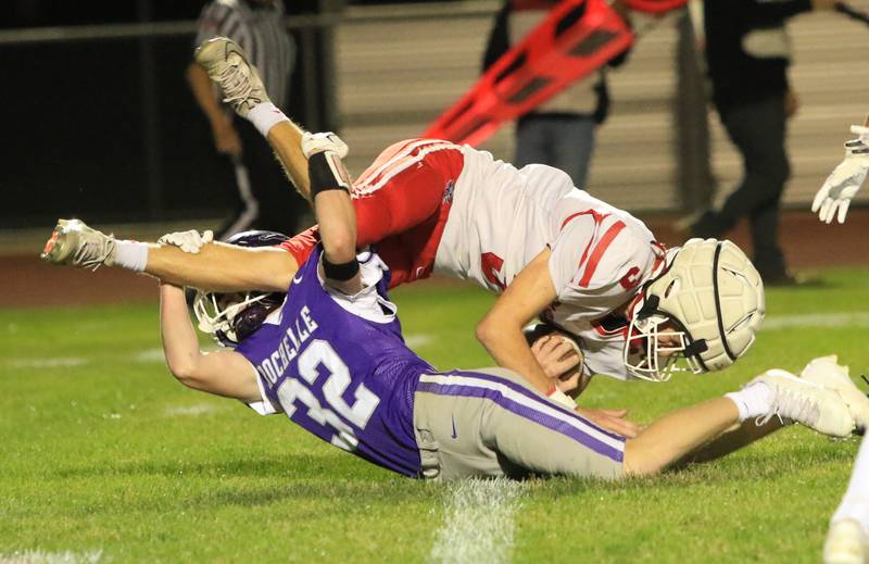 Rochelle's Luke Chadwick (32) trips up an Ottawa ballcarrier during Friday's game in Rochelle.