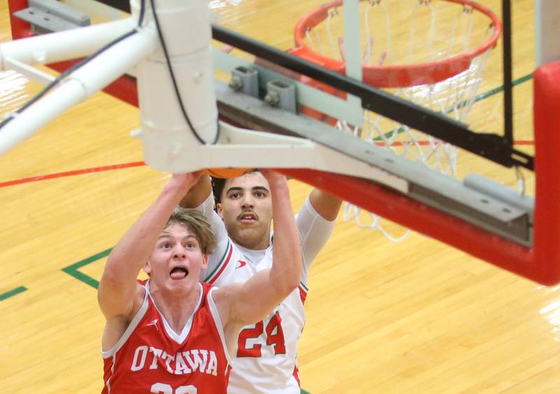 Ottawa's Owen Sanders gets in front of L-P's Marion Persich to score a basket on Friday, Feb. 7, 2025 in Sellett Gymnasium at L-P High School.