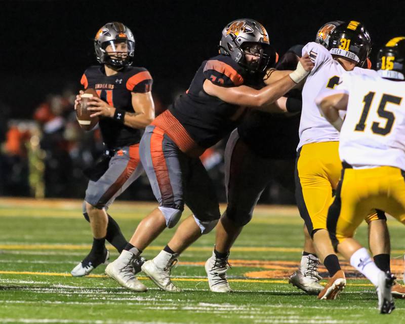 Minooka's Ryan Susnar (72) blocks on a pass play during varsity football game between Joliet West at Minooka.  Sept 2, 2022