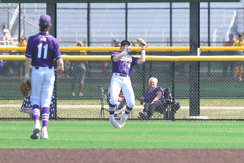 Wilmington’s Dierks Geiss battles the wind to catch a fly ball against Coal City on Monday, March 30, 2026 in Coal City.