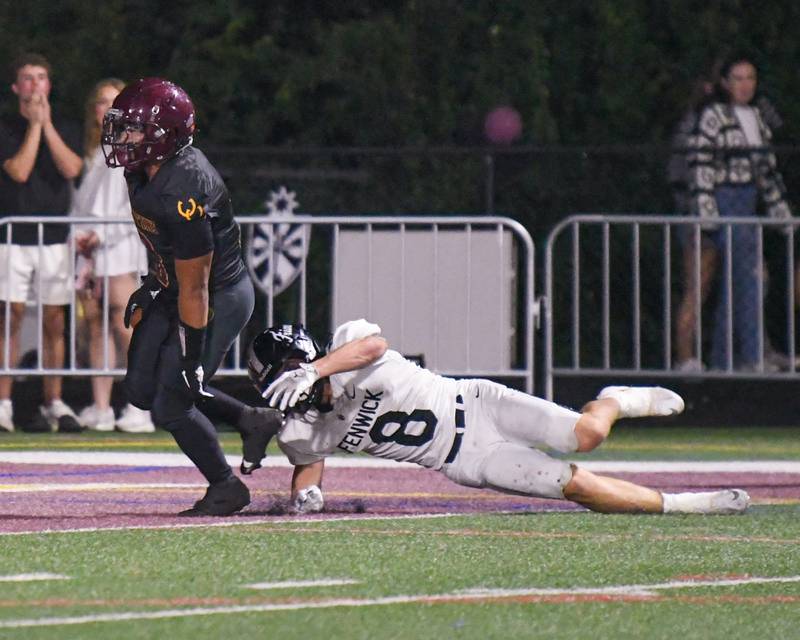 Montini Catholic's Payton Nelson (9) runs into the endzone for a pick six after getting past Fenwick's Jake Thies (8) during the game on Friday Sept. 19, 2025, held at Montini Catholic High School.