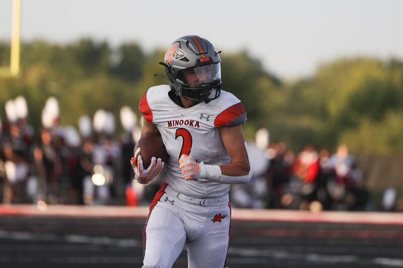 Minooka’s Joseph Partridge rushes upfield against Bolingbrook. Friday, Aug. 26, 2022, in Bolingbrook.
