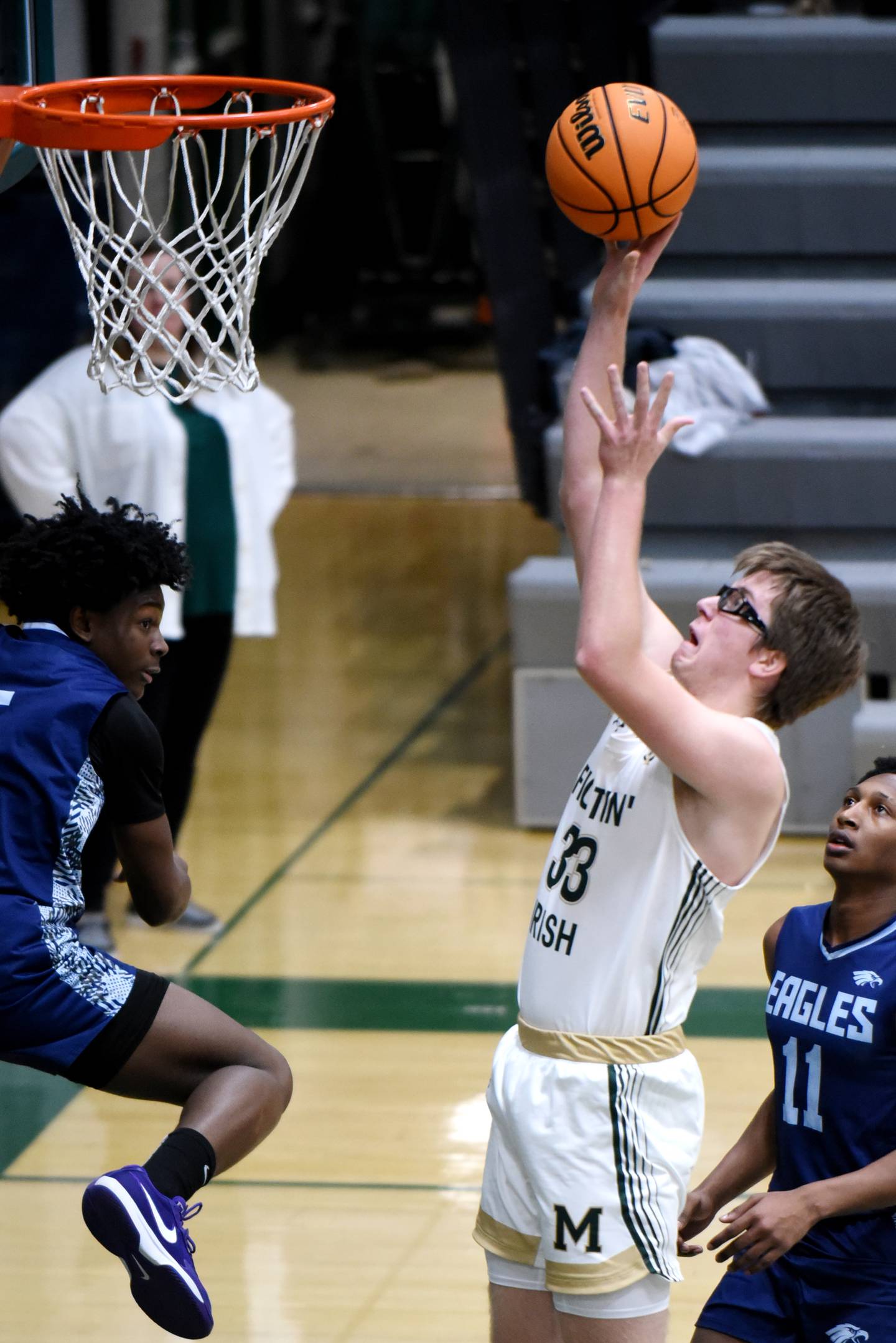Bishop McNamara's Callaghan O'Connor lays one in during a home game against Hope Academy Tuesday, Feb. 11, 2025.