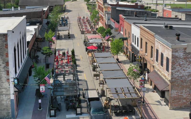 Utica businesses kicked off the outdoor dining season by setting up patio furniture, flowers, decorations and canopies on Thursday, May 8, 2025 for customers on Mill Street downtown Utica. The outdoor dining season on Mill Street runs through October.