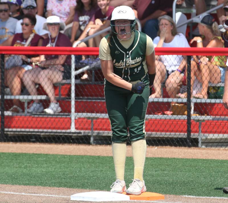 St. Bede's Bella Pinter reacts after reaching first base on a hit in the Class 1A State semifinal game on Friday, June 2, 2023 at the Louisville Slugger Sports Complex in Peoria.