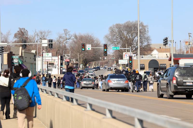 Kankakee High School students cross the Washington Avenue bridge as they participate in a walkout in protest of national immigration policies and Immigration and Customs Enforcement actions on Friday, Feb. 13, 2026.
