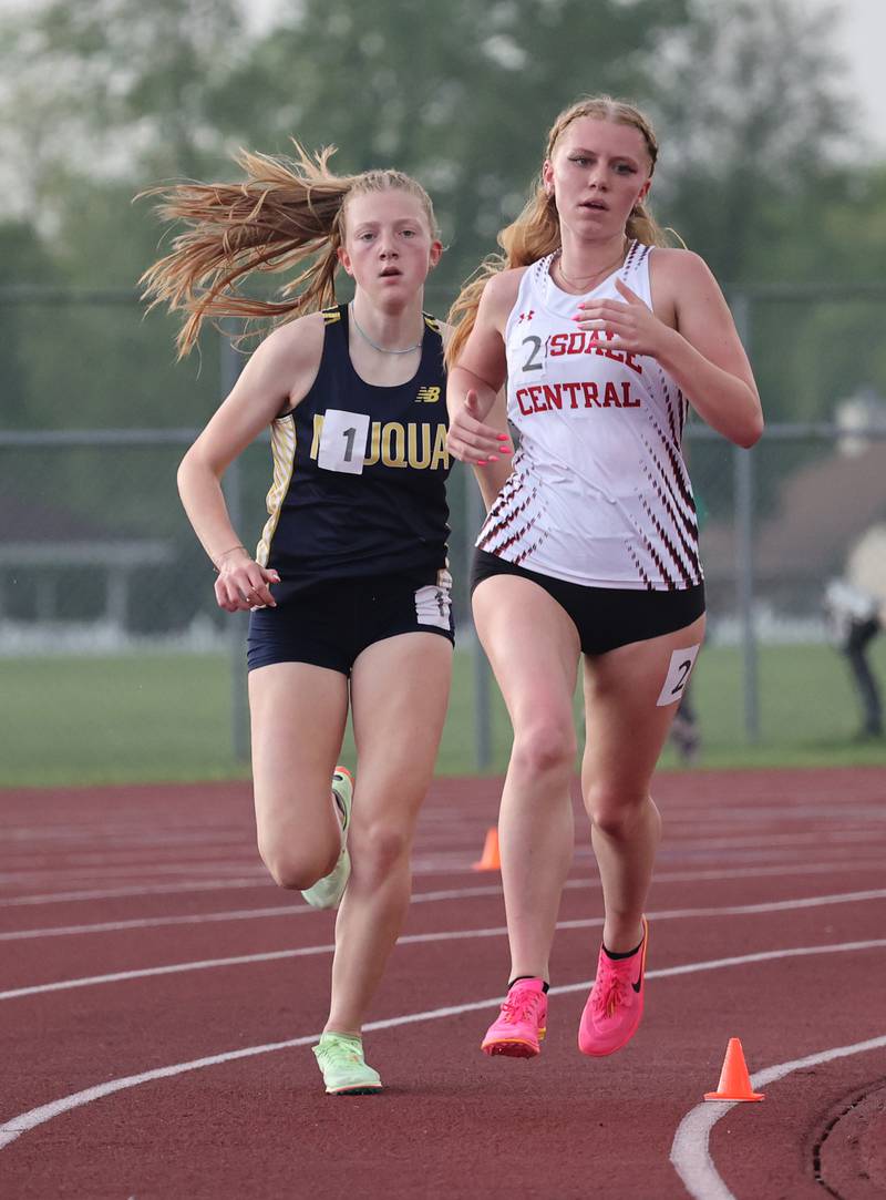 Hinsdale Central's Sarah Fischer runs ahead of Neuqua Valley's Carissa Hamilton in the 3200 meter event during the girls varsity track and field 3A Lockport sectional on Friday, May 12, 2023.