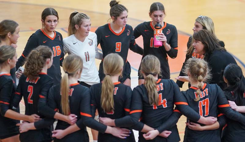 Lincoln-Way West's head coach Kendall Villa (right) talks to her team during a class 4A Oswego Sectional semifinal match at Oswego High School on Monday, Oct. 30, 2023.