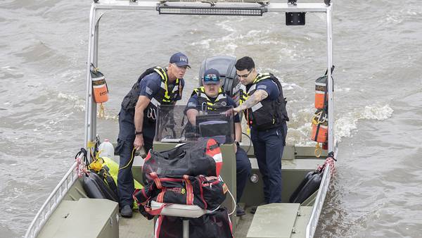 Photos: Search crews work to locate an individual who went into the Rock River