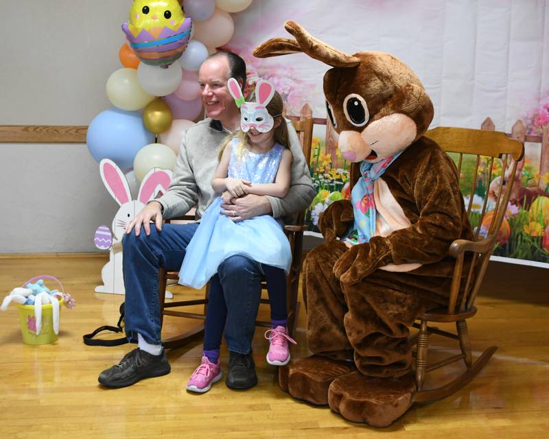 Tim Funfsinn gets a photo with the Easter Bunny and his daughter Alayna Fufsinn, 6, during the DeKalb Park District's annual Breakfast with the Bunny at Hopkins Park, 1403 Sycamore Road in DeKalb on Saturday March 23, 2024.